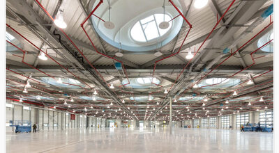 igus Phase 8 Headquarters Expansion showing an almost column-free production hall. Design by Bryden Wood